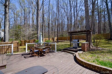 Back Yard - View of the extensive decking, grill d