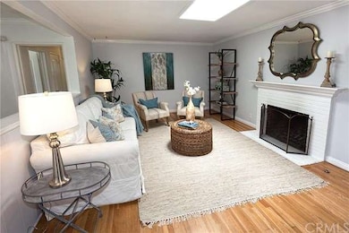 Living Room with fireplace and skylight