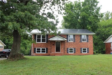Brick exterior and metal roof are low maintenance features on the exterior of this home.