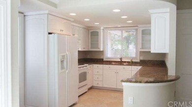 Gorgeous kitchen with Euro-white cabinets, recesse