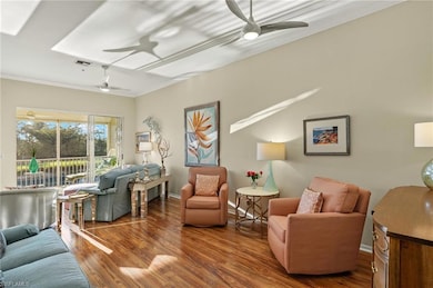 Living room with visible vents, ornamental molding