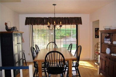 Formal dining room has a Pella sliding glass door 