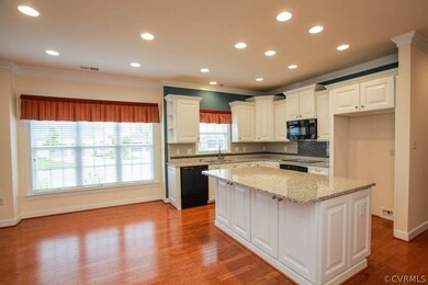 Breakfast area next to kitchen; island also has a