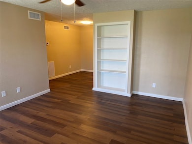 Living area with built in bookshelves.