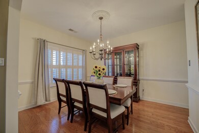 Dining space with an inviting chandelier and light
