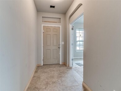 Entry  French doors to the study flank the entrywa