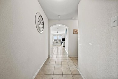 Extended front entryway hallway with tile