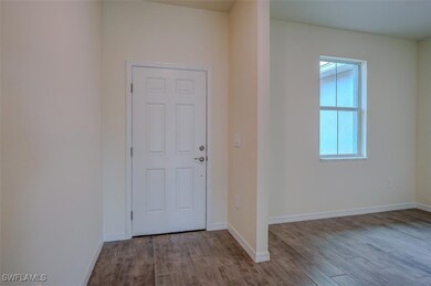 Entrance foyer featuring light wood-type tile floo