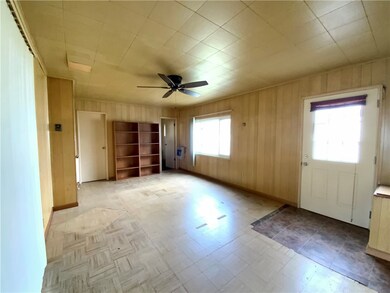 Family off the kitchen with an entry to a large ce