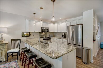Kitchen with granite counter tops and stainless st