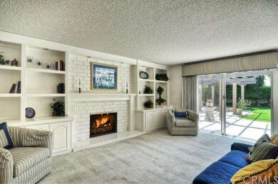 Family Room has Fireplace & Custom Built-In Entert