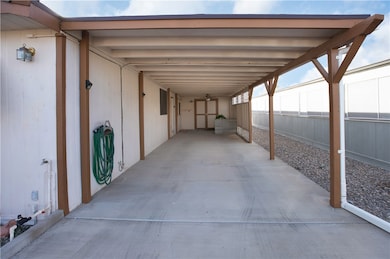 Attached carport and storage shed.