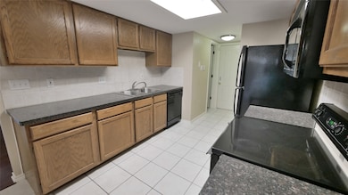 ANOTHER VIEW OF THE KITCHEN