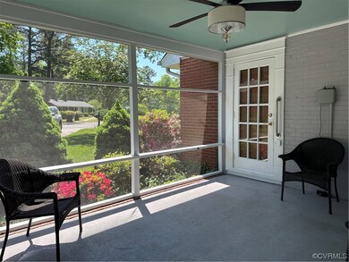 Screened Porch has a ceiling fan and drink railing