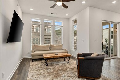 Living room featuring dark wood-type flooring and 