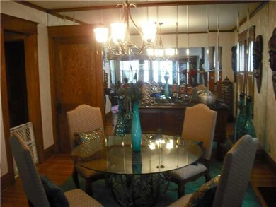 Dining Room. Custom mirror wall in dinning area wi