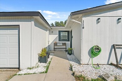 View of side of property with a garage