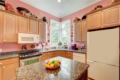 Kitchen with center island, granite counter tops,