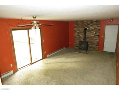 Cozy family room with wood burning stove (heats th
