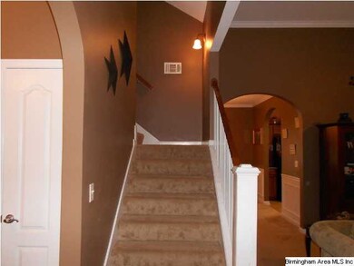Steps off foyer leading to finished bonus room and