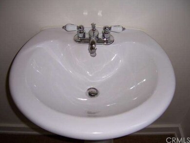 Pedestal sink in bathroom