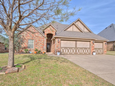 View of front of property featuring a front lawn, concrete driveway, brick siding, a garage, and a shingled roof