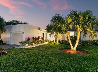 View of front of house featuring a garage, aphalt 
