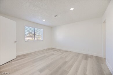 Primary bedroom with walk in closet