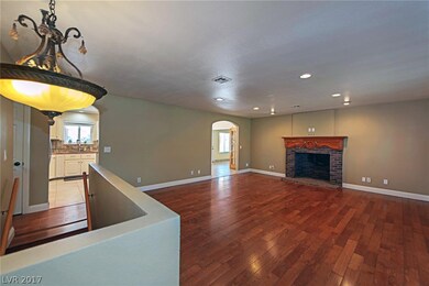 Hardwood Flooring in this Great Room with Fireplac