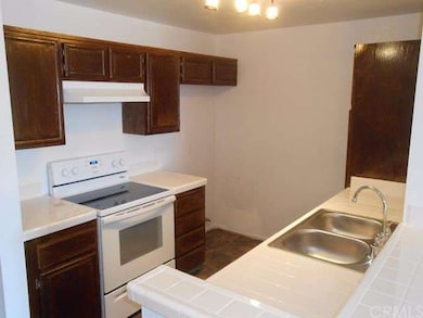 Kitchen with new electric stove and hood