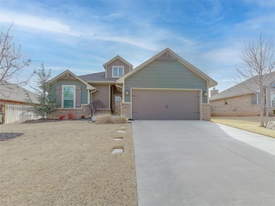 Craftsman inspired home with fence, a garage, and 