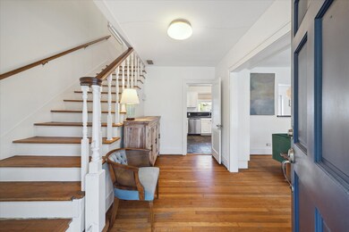 As you walk-through the solid wood navy-blue front