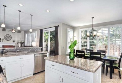 View from kitchen pantry over kitchen island into 