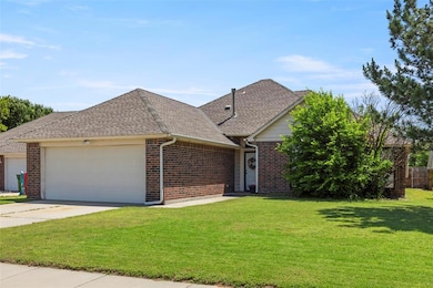 View of front of house with a garage, brick siding, a shingled roof, a front lawn, and concrete driveway