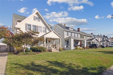 View of front facade featuring a porch and a front lawn