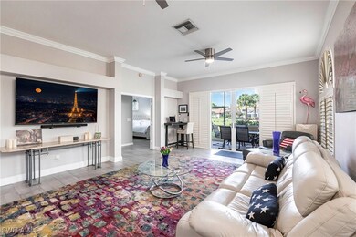 Living area with a ceiling fan, ornamental molding