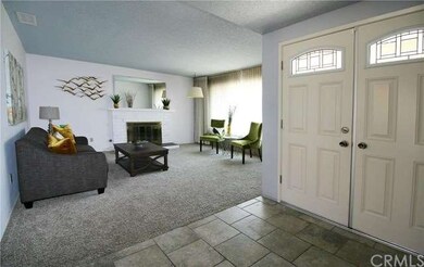 Double door entry with tile floor opens up into th