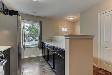 Washer & dryer hook up located in closet off kitchen. Half bathroom is adjacent to laundry closet.