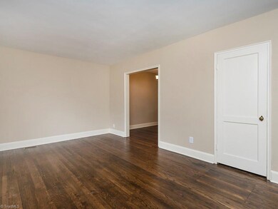 View of spacious Living Room with gorgeous hardwoods