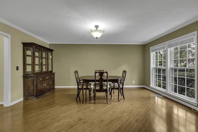 Dining room has space for a large table, china cabinet, and buffet