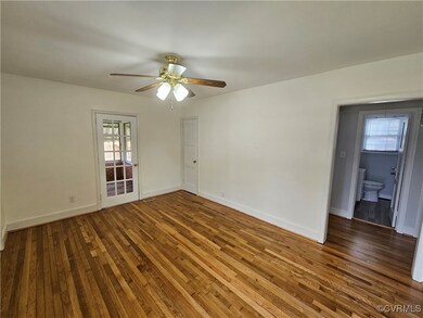 Unfurnished room featuring dark hardwood / wood-st