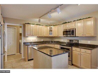Kitchen features granite counters, center island a