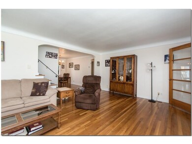 Spacious Living Room with Gleaming Hardwood Floors