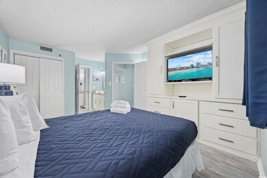 Bedroom featuring connected bathroom, visible vent