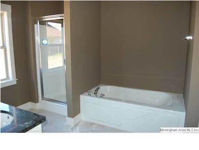 Master bath features seperate tub and shower.