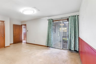 Dining area with sliding door to back patio.