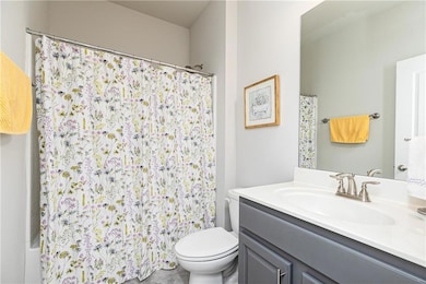 Full bath featuring vanity and a shower with curtain