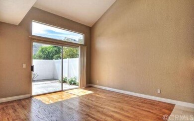 Large, vaulted ceilings in living room opens to pa