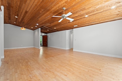 Unfurnished living room featuring light wood-style flooring, wooden ceiling, lofted ceiling, recessed lighting, and ceiling fan