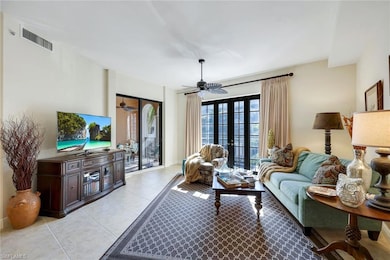 Living room with light tile patterned floors, fren